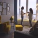 Bearded Guy Gives Present to Long Haired Girlfriend in Room - VideoHive Item for Sale