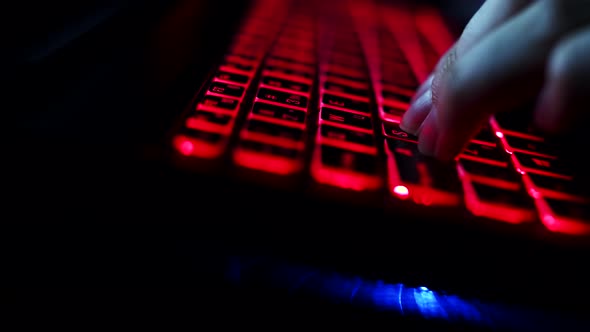 Closeup Fingers of Human Gamer Pressing Keyboard Keys While Playing Games Side View