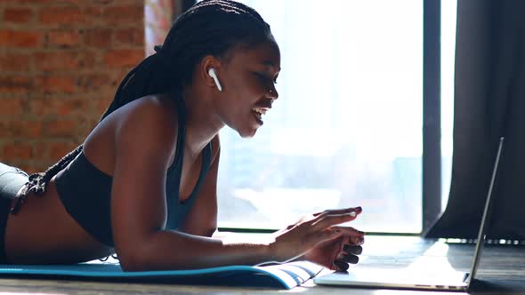 Beautiful Coach Online Blogger Stream From Her House Against the Background of Panoramic Windows