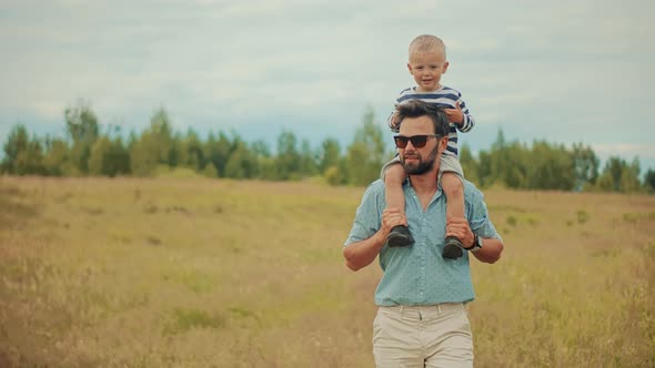 Happy Family Father And Child Boys Leisure. Son Boys Walking Happiness. Cute Little Kid Having Fun.