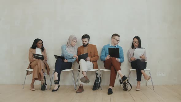 Diverse Group of People Waiting for Job Interview