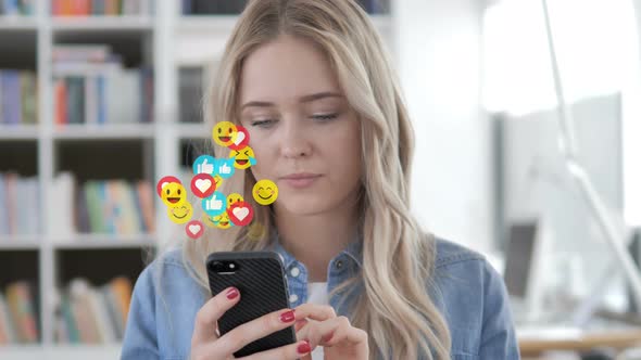 Blonde Woman Watching a Live Stream on Smartphone