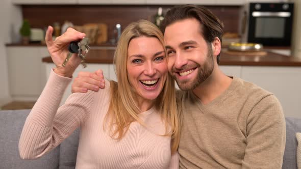 Excited Caucasian Couple in Love Move in a New Apartment