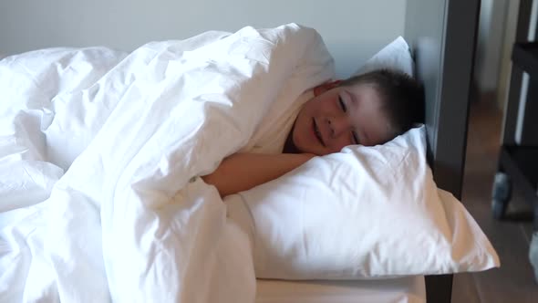 Kid Sleeping Sleepy Child Waking Up the Morning in Bed Room with Morning Light