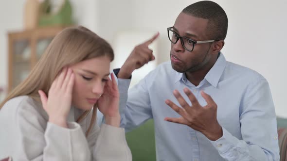 Angry African Man Fighting with Caucasian Woman at Home Couple