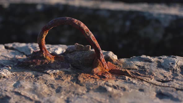 Rusty Metal Sticking Out of a Plate