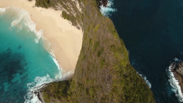 Rocky Cliff with Beach in the Sea. Karang Dawa.