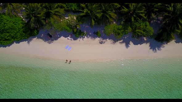Aerial top view seascape of beautiful tourist beach break by turquoise water and bright sandy backgr