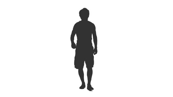 Silhouette of Male Tourist Walking in Shorts