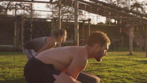 Young adults training at an outdoor gym bootcamp