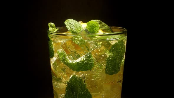 Glass of Cocktail with Lemon, Mint, Ice