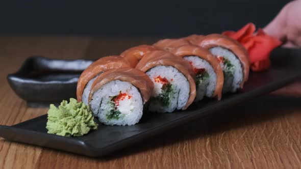 Sushi on a Wooden Table in Restaurant Delicious Japanese Food Sushi Rolls