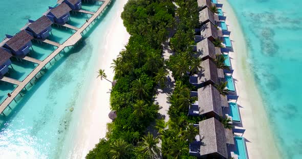 Natural above travel shot of a white sand paradise beach and aqua turquoise water background in high