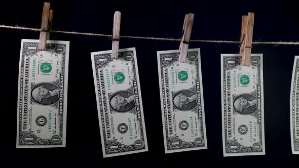 Dollars Dry on a Clothespin Rope