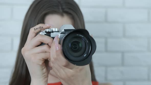 Young photographer takes a photo. 