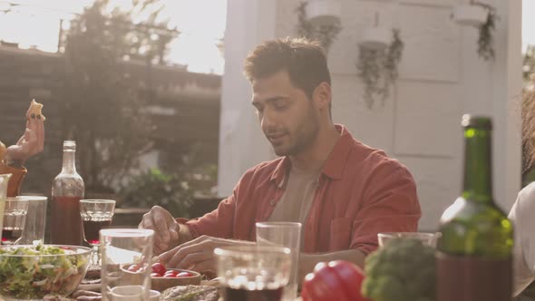 Diverse People Having Dinner in Restaurant