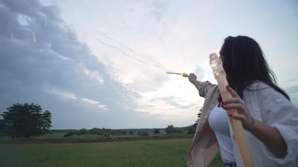 Slow Motion Video of Mom Making Bubbles for Kids