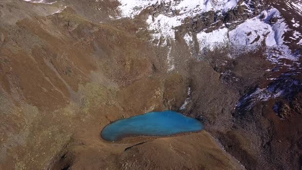 AERIAL: Blue lake in mountains in Italy