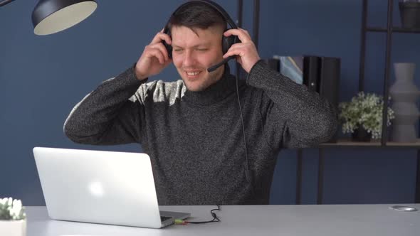 Confident Young Caucasian Man Businessman Freelancer is Working From Home