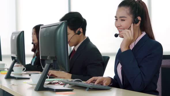 Business People Wearing Headset Working in Office