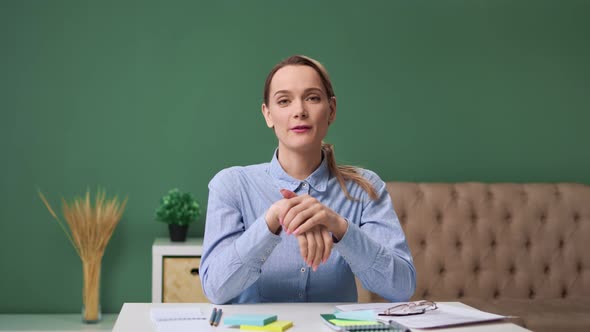 Smiling Woman Influencer Sit on Desk at Home Talk Make Video Call Conference