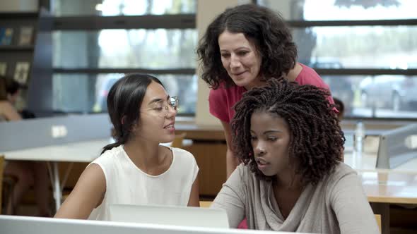 Front View of Mature Students Discussing New Project