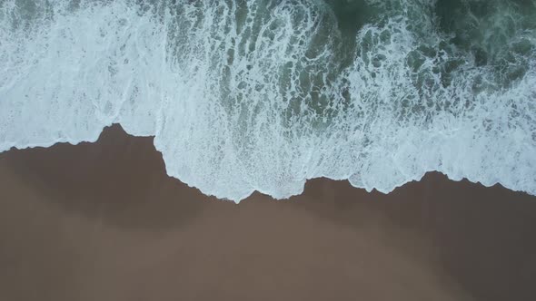 Overhead Shot Of Beautiful Waves Crashing On Sandy Beach, Portugal