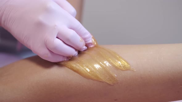 Cropped View of Waxing Hair Removal Procedure in Salon