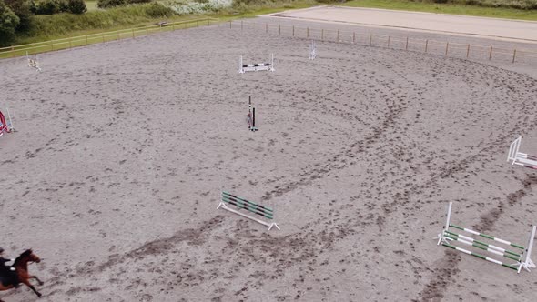 Drone Of Woman Riding Horse Around Paddock