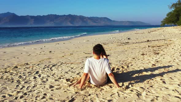 Young Couple in Love Dating on Vacation Have Fun on Beach on White Sand Background