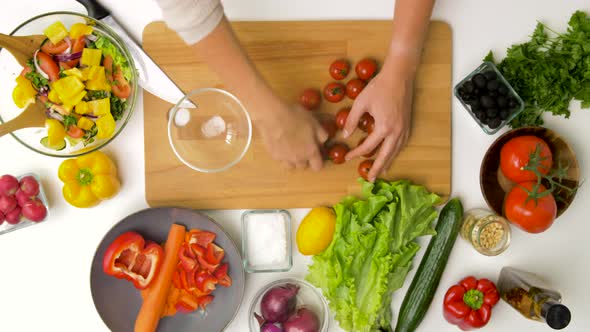 Hands Removing Tails From Red Cherry Tomatoes