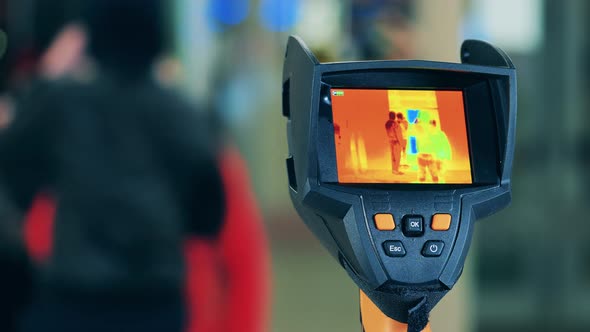 Thermographic Camera Showing People Through Infrared Light