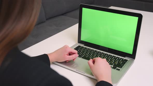 Woman Employee Looking at Chromakey Sitting at Home or Office