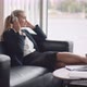 Businesswoman in Headphone Relax on Sofa in Office Lobby - VideoHive Item for Sale