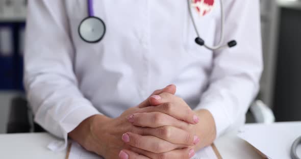 Doctor Cardiologist with Ecg Icon Sitting at Table in Clinic  Movie