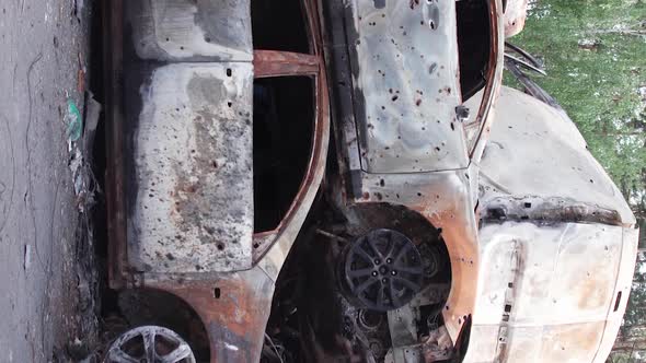 Vertical Video of Burnt and Shot Cars During the War in Ukraine
