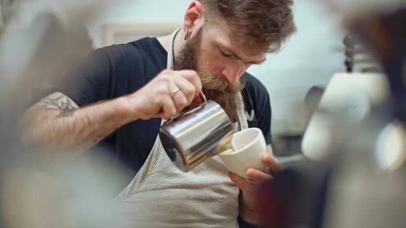 Barista Making Coffee in Coffeeshop