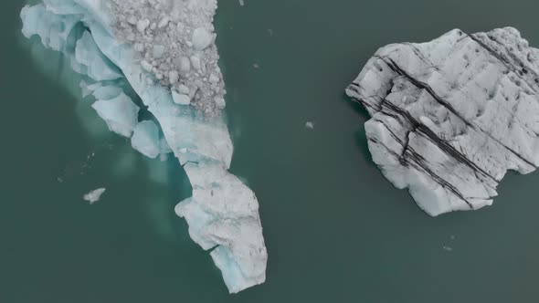 Slow Aerial Flyover Icebergs in a Lagoon.