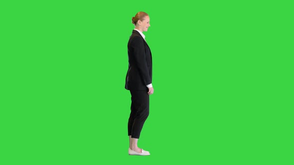 Beautiful Young Woman in Formal Outfit Smiling To Camera on a Green Screen Chroma Key