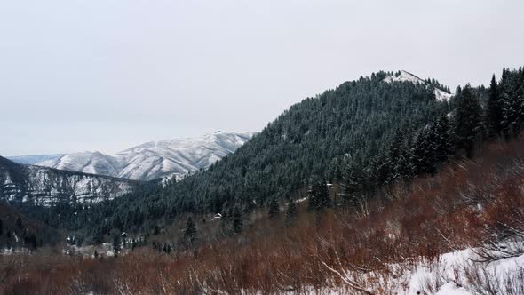 Stunning aerial drone landscape view of Sundance Ski Resort from the Stewart Falls hike. A snowy roc