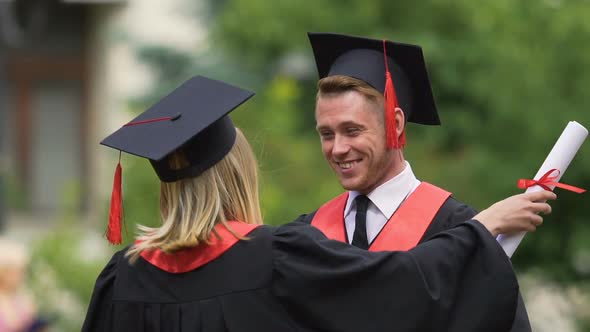 Sincere Goodbye Hug of Best Male and Female Friends Graduating From University