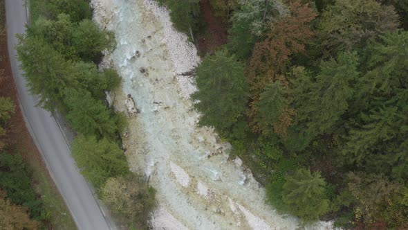 Aerial view of Fast Moving River Surrounded by Forest,