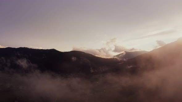 Panoramic View of a Picturesque Mountain Valley with a Village in a Lowland