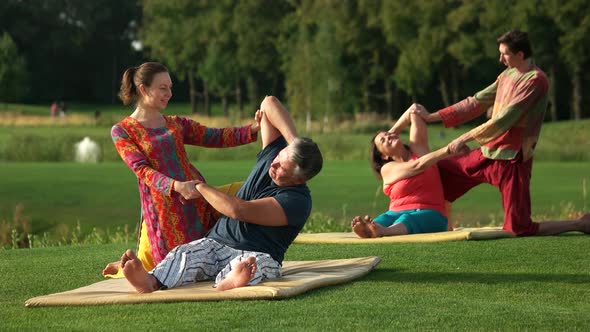 Couple Receiving Thai Massage Stretching