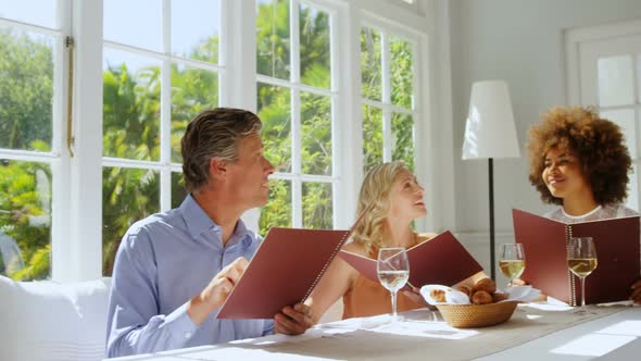 Friends placing order to waitress