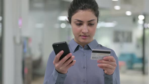 Portrait of Online Payment on Smartphone By Indian Woman