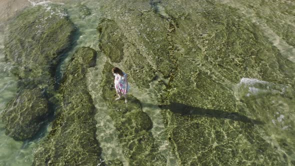 Aerial Overhead Above Smiling Woman in Beach Dress Staying in Shallow Waters