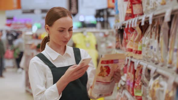 Young Woman Finds Favourite Snacks in Supermarket Closeup