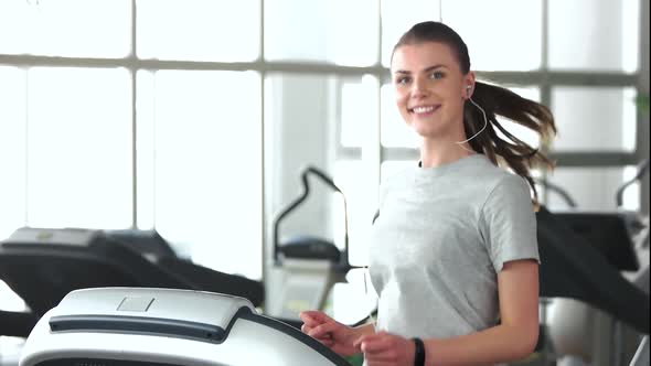 Beautiful Girl Running on Treadmill.