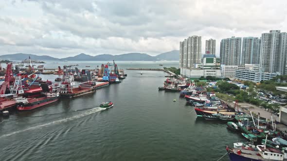 Top view of vessel cruising out to sea from Typhoon Shelter, Hong Kong